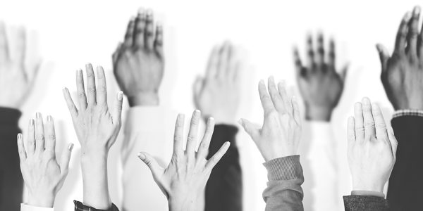Multiethnic Group of Hands Raised